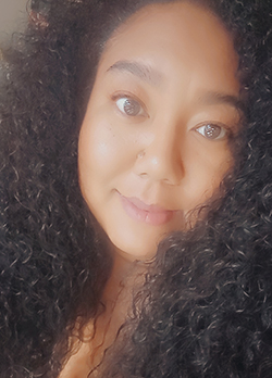 Woman with long, thick, curly, dark brown hair